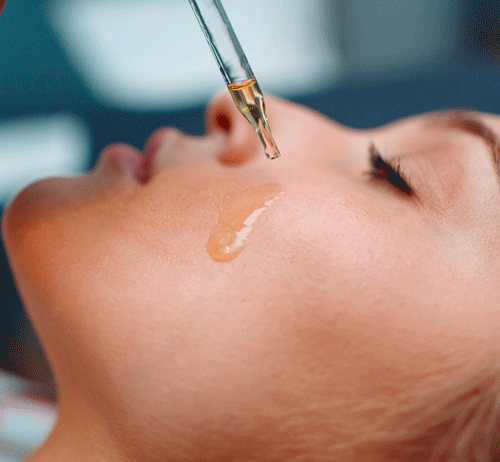 woman with oil drop on face